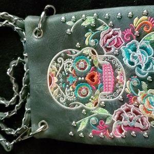 Dia Los Muertos crossbody bag. 22" chain and leather strap. One main pocket with